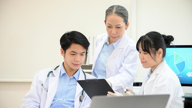 A team of Asian scientist planning and brainstorming on their Microbiology development research