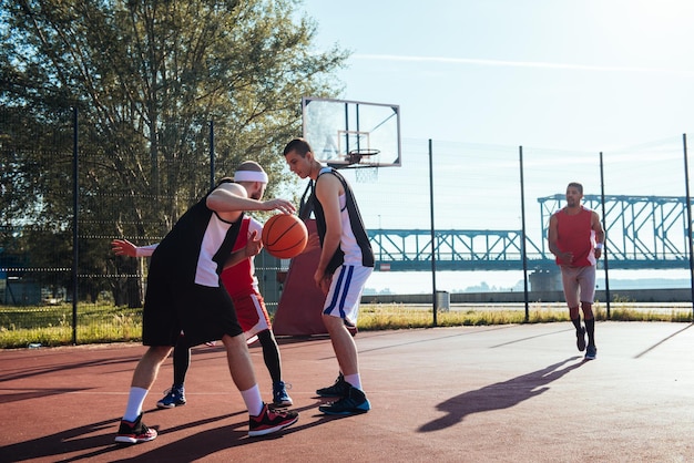 Team of basketball players making an action together.