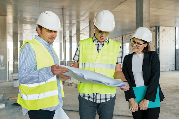 Team of builders engineers at construction site