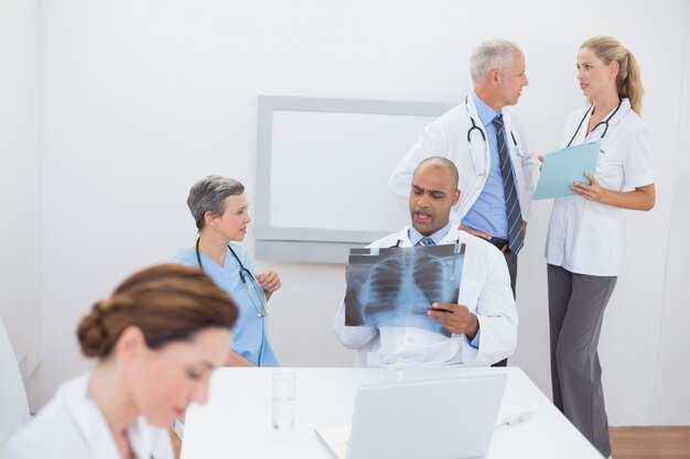 Team of doctors working on their files