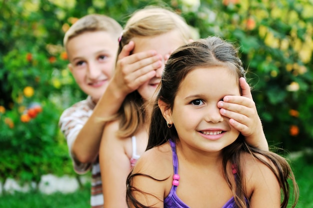 team group of happy child outdoor in nature have fun