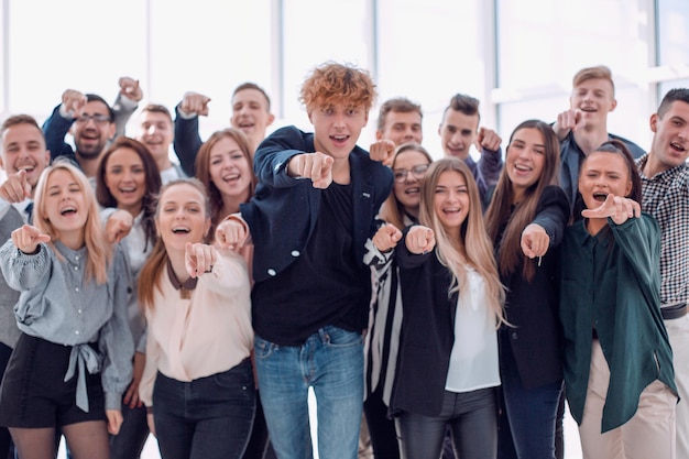 team of happy young men pointing at the camera. photo with copy space