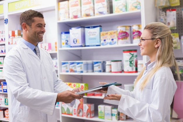 Team of pharmacists smiling at camera