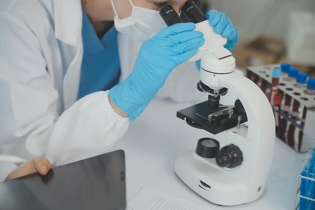 Team of Scientists Choose Between Printed Circuit Board to Work With In The Background Technologically Advanced Scientific Research Center