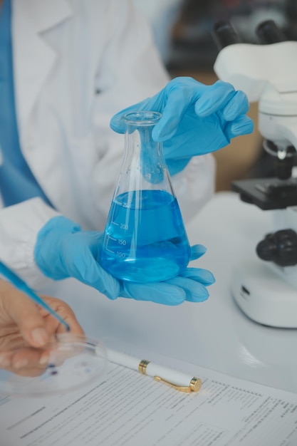 Team of Scientists Choose Between Printed Circuit Board to Work With In The Background Technologically Advanced Scientific Research Center