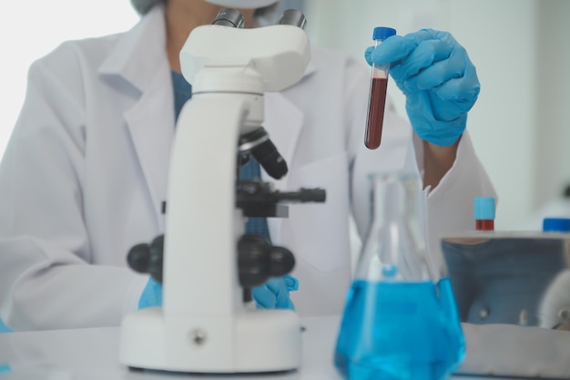 Team of Scientists Choose Between Printed Circuit Board to Work With In The Background Technologically Advanced Scientific Research Center