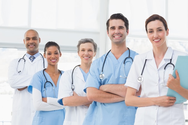 Team of smiling doctors looking at camera