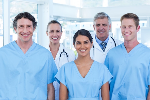 Team of smiling doctors looking at camera