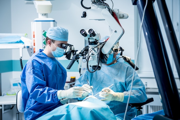 A team of surgeons performing brain surgery to remove a tumor