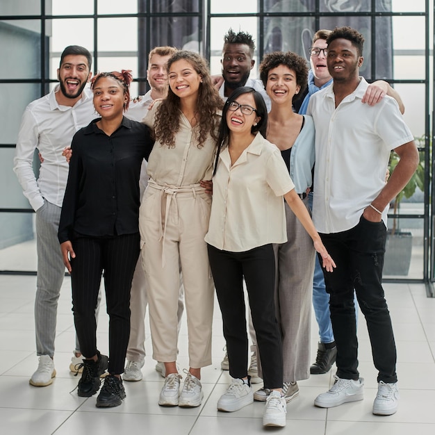 Team at work group of young business people in smart casual wear working together in creative office