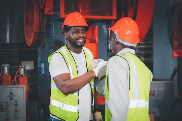 Teamwork African American worker in the factory Black man afro work heavy industrial