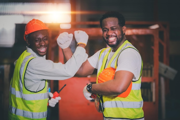 Teamwork African American worker in the factory Black man afro work heavy industrial