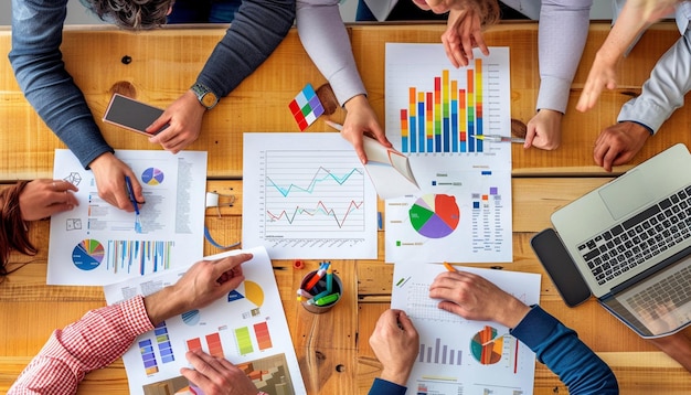 Teamwork with business people analysis cost graph on the desk in the meeting room The business team discussed meetings and briefing strategies