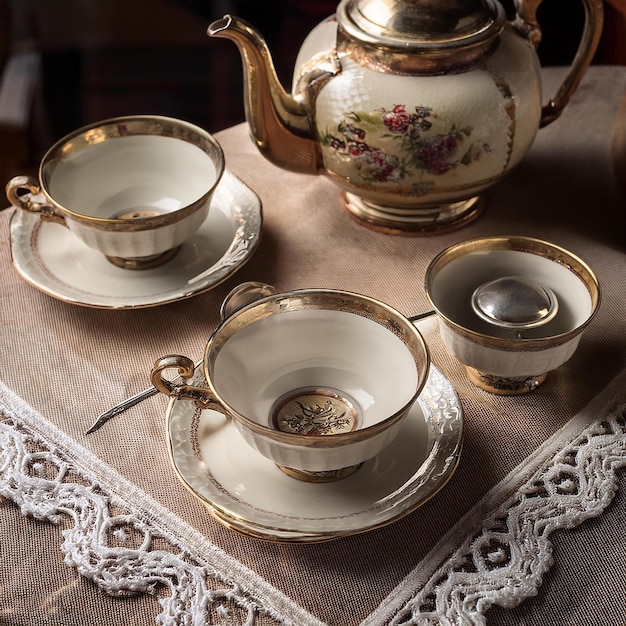 Photo a teapot and tea set on a table with a tea cup and saucer