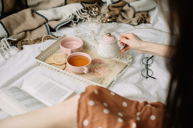 Teapot with tea and cups on a tray