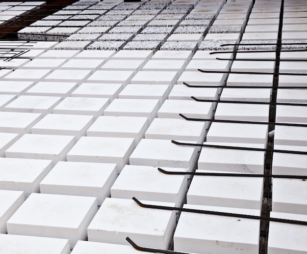 Technical detail of building operations: floor. Materials: polystyrene, steel bars, concrete