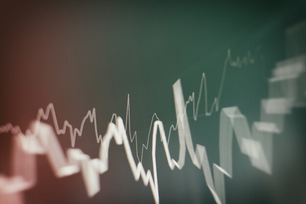 Technical price graph and indicator, red and green candlestick chart on blue theme screen, market volatility, up and down trend. Stock trading, crypto currency background.