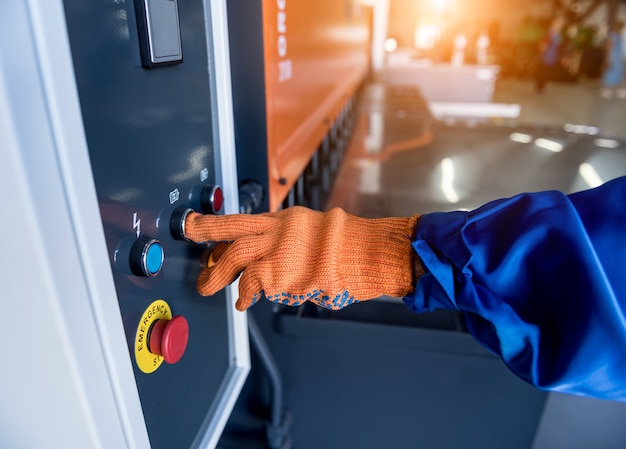 The technician operator use hydraulic bending machine