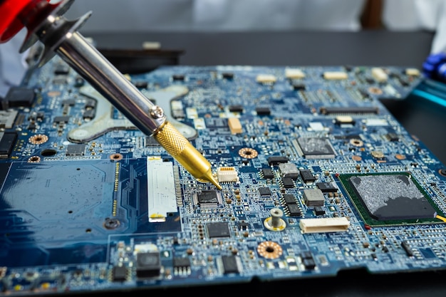 technician repairing inside of hard disk.