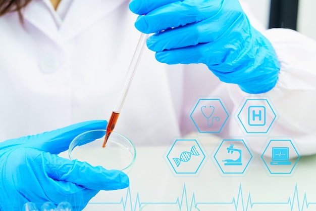 Technician scientist analyzing holding test tube in laboratory holding blood sample