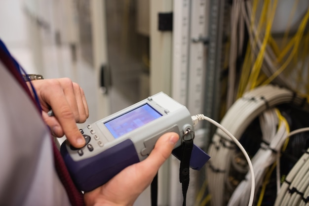 Technician using digital cable analyzer