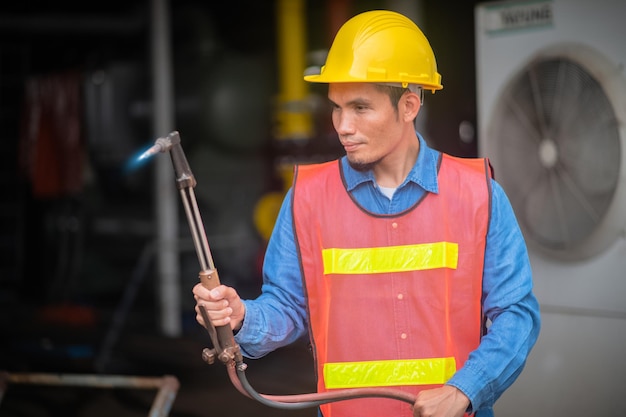 Technician Workman Philippines in Asia checking maintenance machine in manufacturing industrial