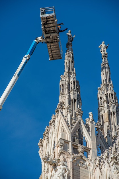 Technicians on lifting platform for scheduled maintenance plan and study of the degradation