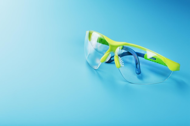 Technological protective green glasses isolated on