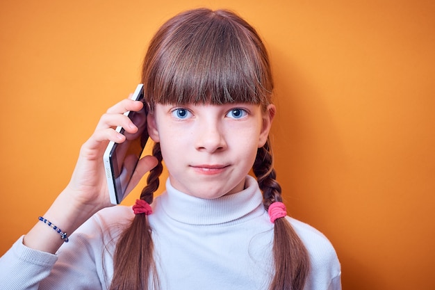 Technology and communication caucasian teen girl talking on the phone