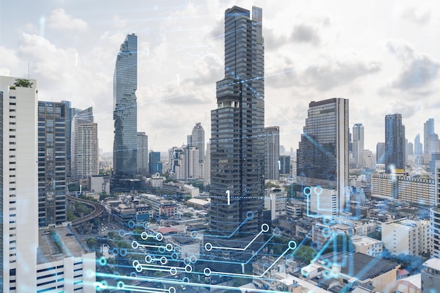 Technology hologram over panorama city view of Bangkok The largest tech hub in Southeast Asia The concept of developing coding and hightech science Double exposure