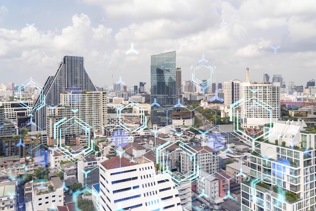 Technology hologram over panorama city view of Bangkok The largest tech hub in Southeast Asia The concept of developing coding and hightech science Double exposure