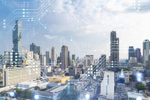 Technology hologram over panorama city view of Bangkok The largest tech hub in Southeast Asia The concept of developing coding and hightech science Double exposure