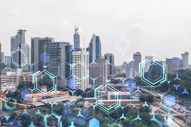 Technology hologram over panorama city view of Kuala Lumpur KL is the largest tech hub in Malaysia Asia The concept of developing coding and hightech science Double exposure