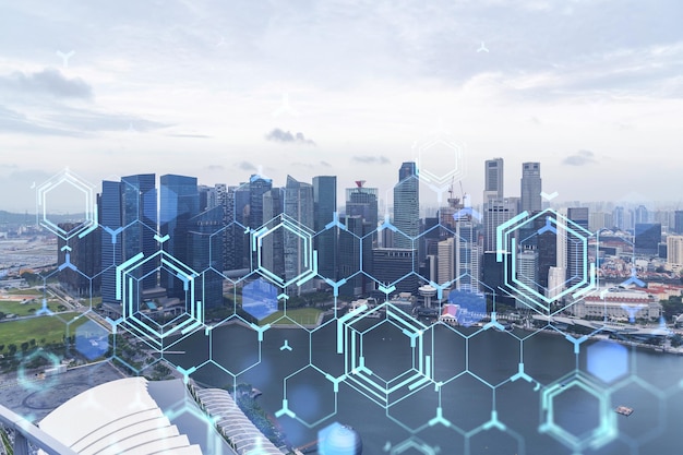 Technology hologram over panorama city view of Singapore The largest tech hub in Asia The concept of developing coding and hightech science Double exposure