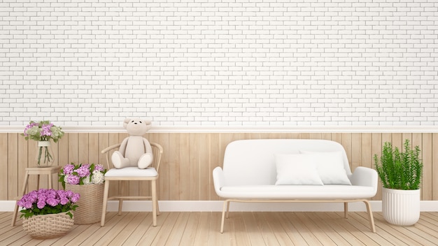 Teddy bear on chair and flowers near sofa