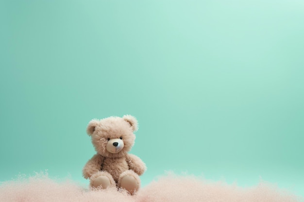 a teddy bear sitting on sand