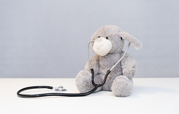 Teddy bear with stethoscope health care teddy bear on background and stethoscope