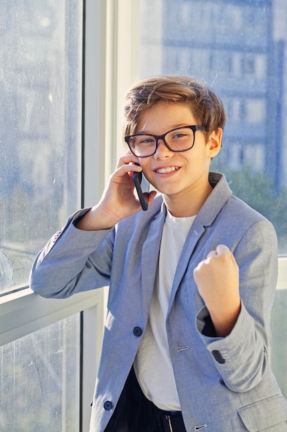 Teen boy using mobile phone