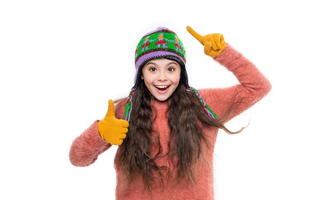 Teen girl in winter hat show thumb up isolated on white background teen girl wear sweater