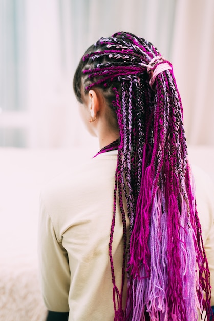 Teen girl with bright pigtails with purple thread Zizi