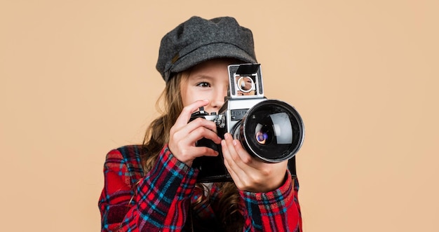 Teen girl with retro photo camera wear trendy hat and checkered jacket vintage photography