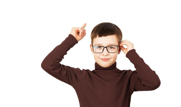 a teenage boy in a brown tshirt and glasses isolated on a white background