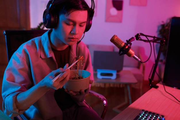 Teenage Boy Eating Ramen