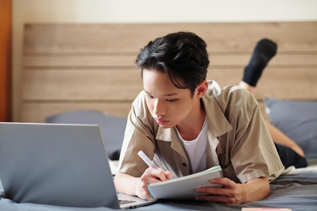 Teenage Boy Reading Online Article