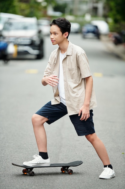 Teenage Boy Riding on Skateboard