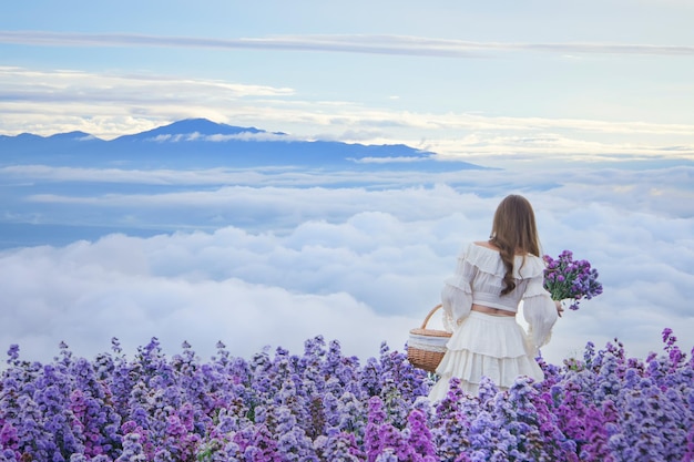 teenage girl in a garden of flowers,Young happy asian girl in Margaret Aster flowers field in garde