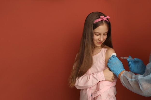 A teenage girl is vaccinated