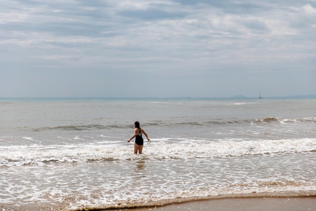 Teenage girl swimming in sea water