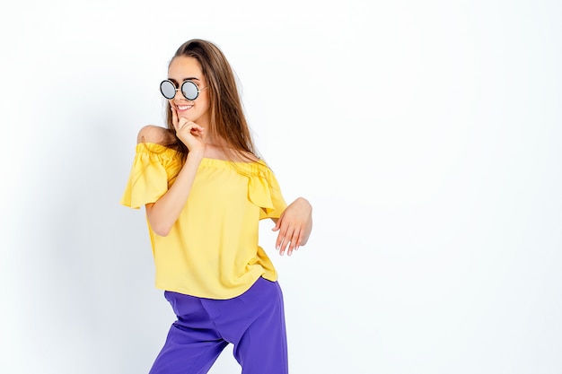 Teenage model with messy hair posing in casual clothes