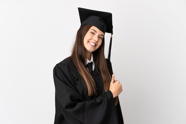 Teenager Brazilian university graduate over isolated white background giving a thumbs up gesture